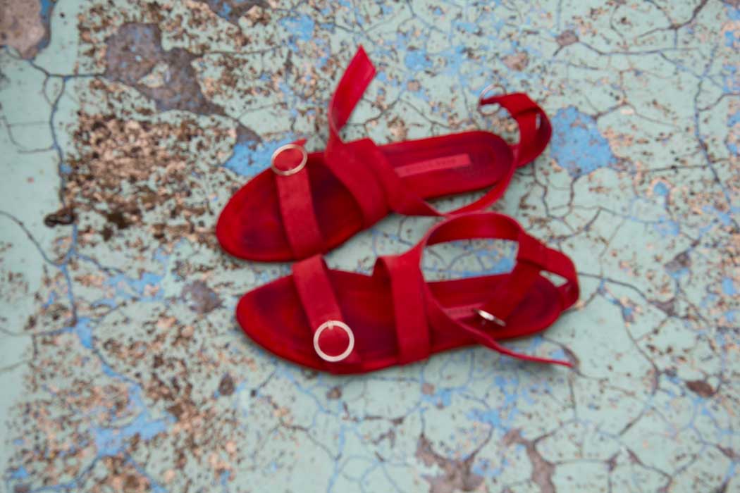 Red shoes on blue pool